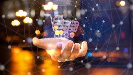 Graphic with an ecommerce symbol levitating over a hand.
